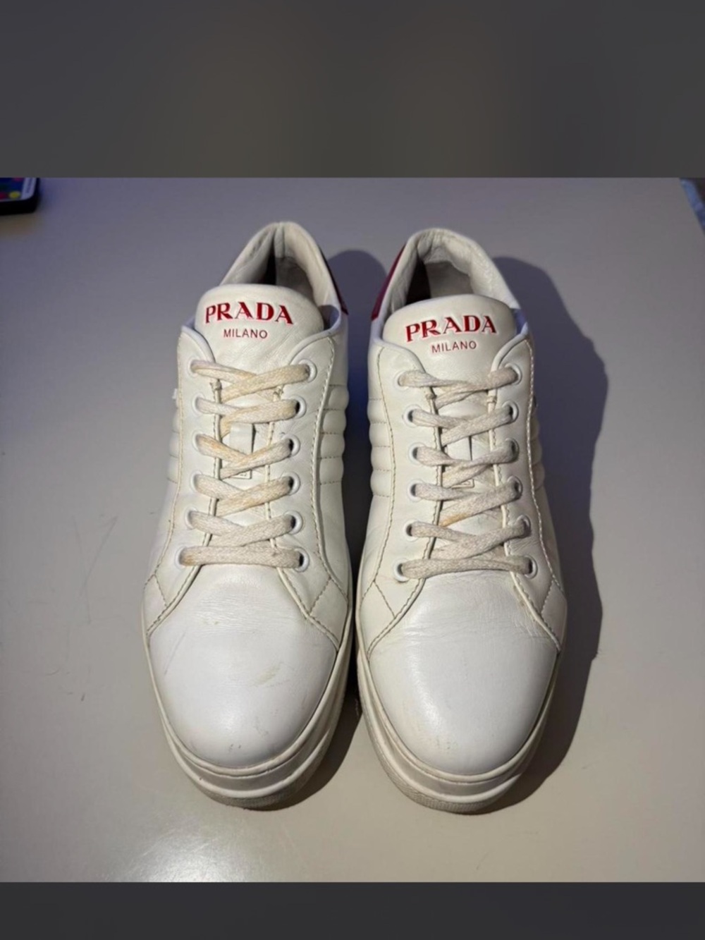 Prada White Leather Low-Top Sneakers with Red Logo
